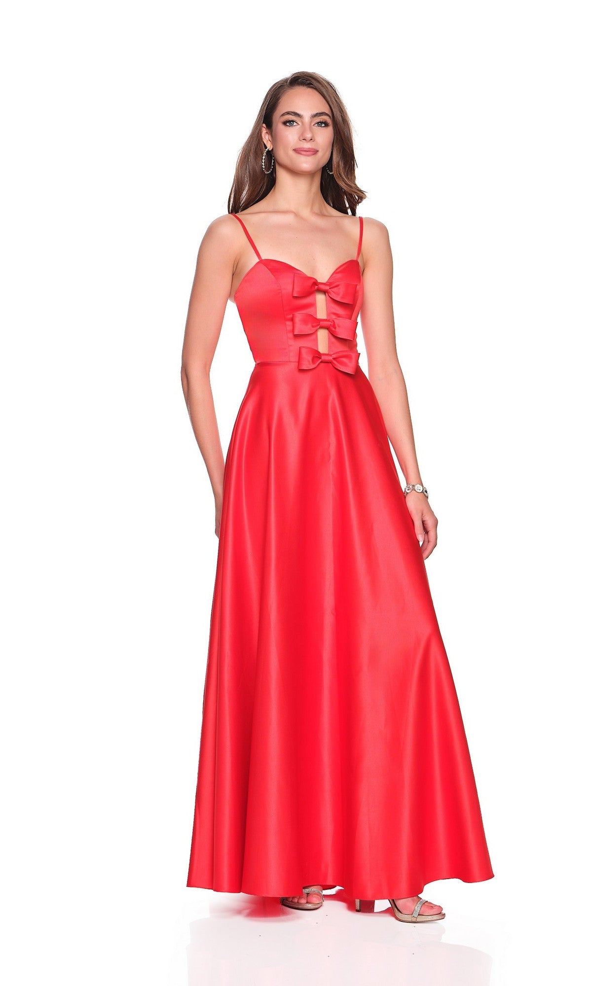 A woman poses against a white background wearing the Dave and Johnny 12572, a long sleeveless red prom dress featuring cut-out and bow details on the bodice.
